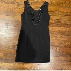 Little black dress with sheer V and bedazzled.